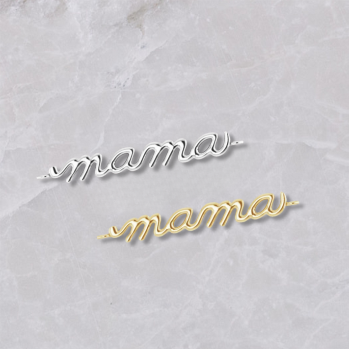 Two permanent jewelry connectors on a marble background, spelling 'mama'. The top shows sterling silver, the bottom shows 14k yellow gold. 
